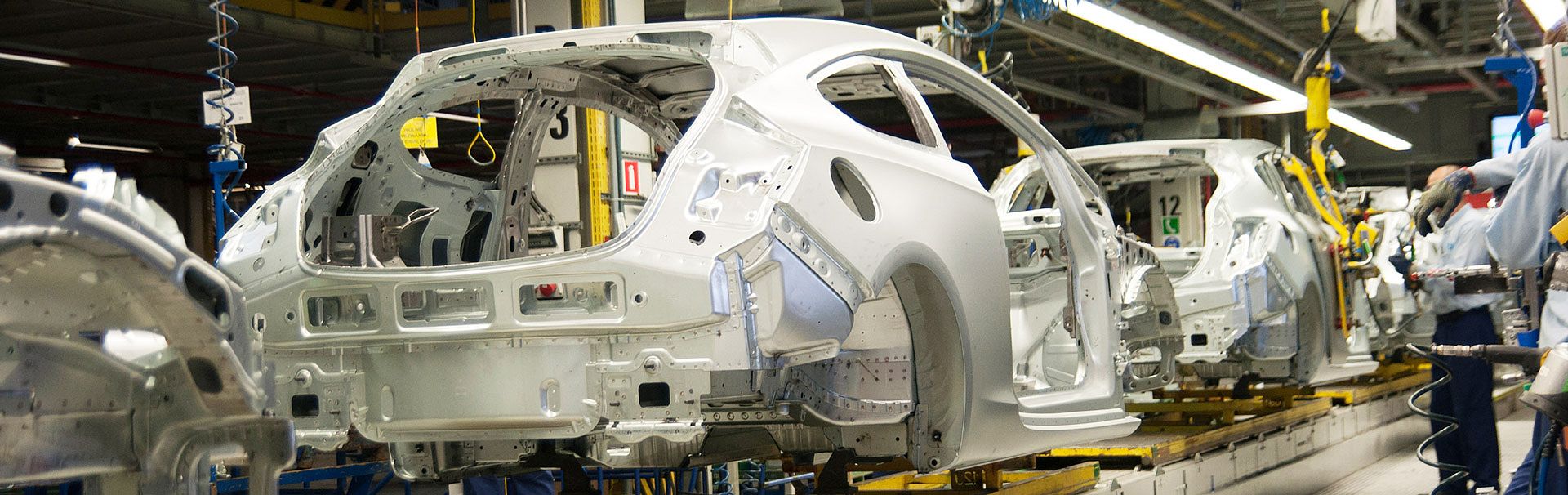 [Translate to Französisch:] Foto einer Fließbandfertigung in der Automobilindustrie
